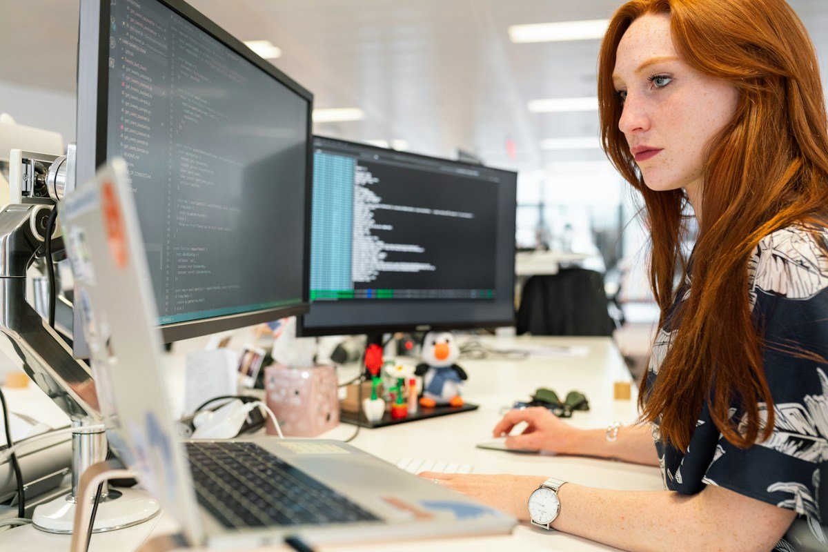 Software engineer working at a coding workstation